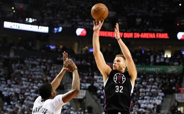 Los Angeles Clippers power forward Blake Griffin shoots over Portland Trail Blazers' Moe Harkless.