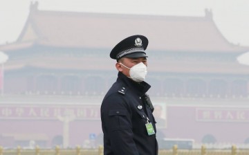 A policeman wearing a a mask to protect himself from air pollution. China's air quality is considered as one of the most severe in the world.