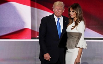 Presumptive Republican presidential nominee Donald Trump stands with his wife Melania after she delivered a speech on the first day of the Republican National Convention on July 18, 2016 at the Quicken Loans Arena in Cleveland, Ohio.