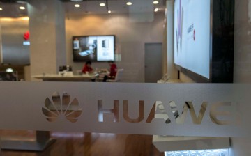 Employees man a Huawei Experience Store in Jiangsu Province.