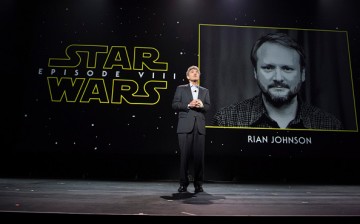 Star Wars Episode VIII director Rian Johnson is shown on the screen during a Disney fan event.