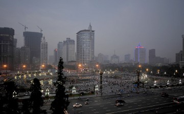 The tall buildings of Chengdu financial district are seen in the background of the photo of the downtown area. 