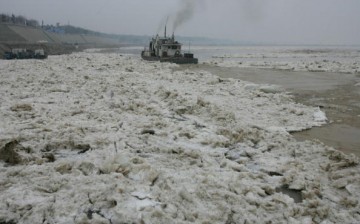 An icebreaker clears ice drift in the Yellow River on Jan. 28, 2008, in Jinan of Shandong Province, China.