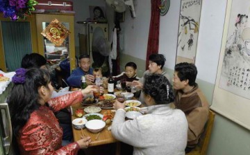 A Chinese family sharing a meal together.