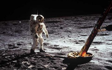 Astronaut Edwin E. Aldrin Jr., lunar module pilot, walks on the surface of the moon near a leg of the Lunar Module during the Apollo 11 extravehicular activity (EVA). Astronaut Neil A. Armstrong, Apollo 11 commander, took this photograph with a 70mm lunar