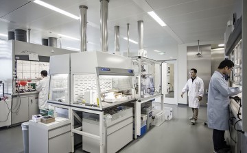Researchers work in a medical lab of Novartis in Shanghai.