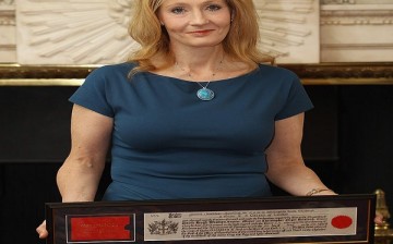 Author J.K. Rowling holds a certificate after being presented with the Freedom of the City of London, at Mansion House on May 8, 2012 in London, England. 