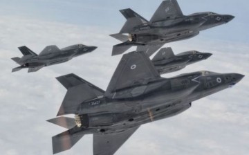 Four U.S. Air Force F-35 stealth fighters in formation.
