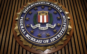 An ex-FBI employee pleads guilty to acting as an 