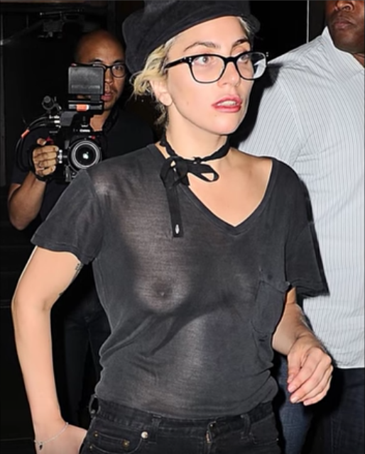 Lady Gaga flashes her breasts as she exits a recording studio in NYC on Tuesday, Aug. 2.