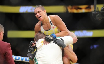 Amanda Nunes celebrates her victory over Miesha Tate during the UFC 200 event at T-Mobile Arena on July 9, 2016 in Las Vegas, Nevada.