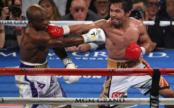 Manny Pacquiao (R) throws a right at Timothy Bradley Jr. in the seventh round of their welterweight fight at MGM Grand Garden Arena on April 9, 2016 in Las Vegas, Nevada.