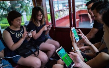  People are seen playing during Hong Kong's first 'Pokemon Go' tram party organized by 'Sam the Local', on July 30, 2016 in Hong Kong.