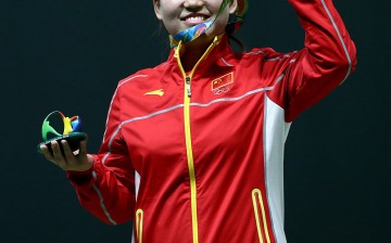 Mengxue Zhang of China wins gold medal in the Women's 10m Air Pistol event at the 2016 Rio Olympics.