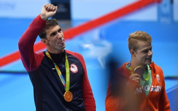 Gold medalist Michael Phelps of the United States celebrates during the medal presentation for the Men's 4 x 200m Freestyle Relay Final on Day 4 of the Rio 2016 Olympic Games at the Olympic Aquatics Stadium on August 9, 2016 in Rio de Janeiro, Brazil.