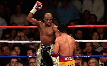 Floyd Mayweather Jr. reacts in the 12th round during the welterweight unification championship bout on May 2, 2015 at MGM Grand Garden Arena in Las Vegas, Nevada.
