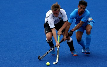 Mats Grambusch #8 of Germany battles Kothajit Khadangbam #5 of India for a loose ball during a Men's Pool B match on Day 3 of the Rio 2016 Olympic Games at the Olympic Hockey Centre on August 8, 2016 in Rio de Janeiro, Brazil. 