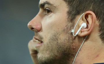 Daniel Menzel of the Cats adjusts his headphones during the round 16 AFL match between the Geelong Cats and the Sydney Swans at Simonds Stadium on July 8, 2016 in Geelong, Australia.