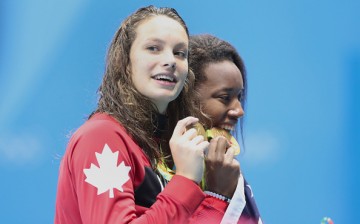Simone Manuel of the United States who dead heated with Penny Oleksiak of Canada to both win the gold medal in the Women's 100m Freestyle Final during the swimming competition at the Olympic Aquatics Stadium Aug,11, 2016 in Rio de Janeiro, Brazil. 