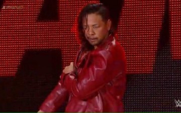 Shinsuke Nakamura looks determined during his entrance at an NXT event.