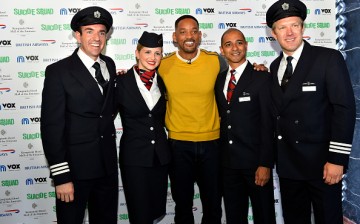  British Airways pilots Andy Perkins(R) and Will Swinburn(L) pose for a group photo with Will Smith during an exclusive Q&A about his role in his latest blockbuster Suicide Squad, on August 7, 2016 in Dubai, United Arab Emirates.