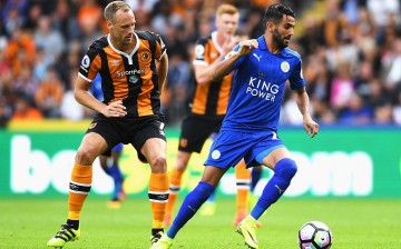 Leicester City winger Riyad Mahrez (R) competes for the ball against Hull City's David Meyler.