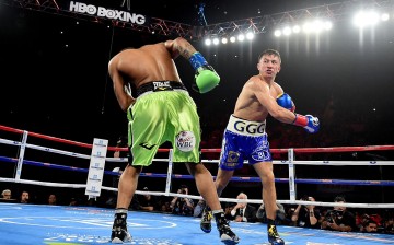 Gennady Golovkin of Kazakhstan punches Dominic Wade on way to a second round TKO during his unified middleweight title fight at The Forum on April 23, 2016 in Inglewood, California.