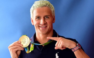 Competitive swimmer Ryan Lochte of the United States poses for a photo with his gold medal on the Today show set on Copacabana Beach on August 12, 2016 in Rio de Janeiro, Brazil. 