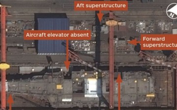 A satellite photo from Airbus Defence and Space shows the hull of CV-17 in dry dock at Dalian.