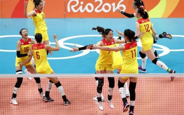 China's players celebrate after the women's gold medal match of Volleyball against Serbia at the 2016 Rio Olympic Games in Rio de Janeiro, Brazil, on Aug. 20, 2016. China won the gold medal.