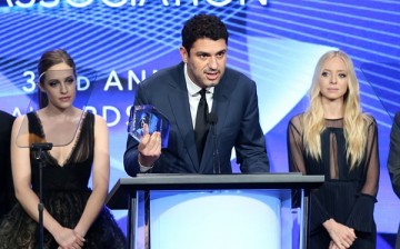 Sam Esmail accepts the award for 'Outstanding New Program' for 'Mr. Robot' with Carly Chaikin and Portia Doubleday (R) onstage at the 32nd annual Television Critics Association Awards during the 2016 Television Critics Association Summer Tour. 