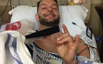 Finn Balor poses after successful surgery to repair his injured right shoulder.