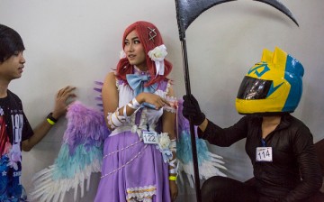 Japanese cosplay blooms in Myanmar as coplayers wait in the stairway before going on stage at MICT park on April 23, 2016 in Yangon, Burma.  