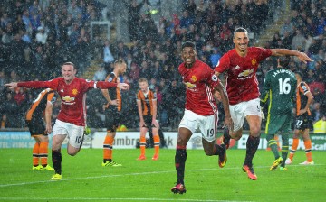 Manchester United players (from L to R) Wayne Rooney, Marcus Rashford, and Zlatan Ibrahimović celebrating their goal against Hull City.