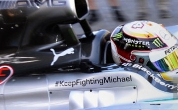 Mercedes driver Lewis Hamilton of Britain speeds out of the pits with a special tribute to Michael Schumacher written on the side during the first practice session at the Formula One Australian Grand Prix at the Albert Park circuit in Melbourne on March 1