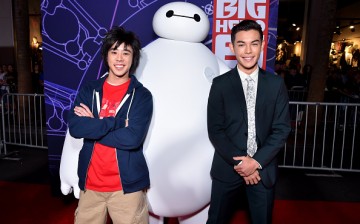 Actor Ryan Potter (R) with characters Hiro and Baymax attends the Los Angeles Premiere of Walt Disney Animation Studios Big Hero 6' at El Capitan Theatre on November 4, 2014 in Hollywood, California. 