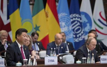 Chinese President Xi Jinping and Russian President Vladimir Putin sit side by side during the G20 Summit.