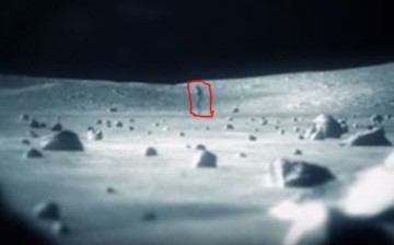 Alien spotted on the moon's surface.