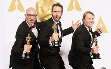 (L-R) Chris Williams, Roy Conli, and Don Hall, winners of the Best Animated Feature Award for 'Big Hero 6', pose in the press room during the 87th Annual Academy Awards at Loews Hollywood Hotel on February 22, 2015 in Hollywood, California