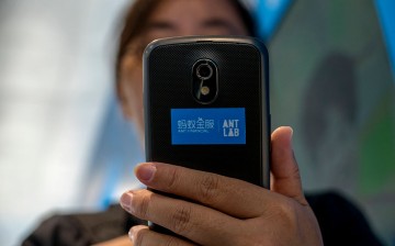 A user tries the new services developed by Ant Financial on a mobile phone.