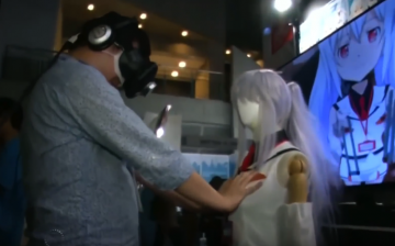 A male visitor trying out M2's E-mote software at the Tokyo Game Show. 