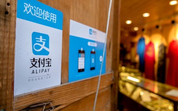 A clothes shop in Lijiang, Yunnan Province, displays a signboard telling customers that it accepts payments through Alipay.