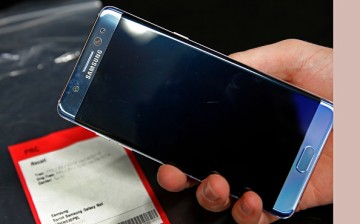 A Samsung Galaxy Note 7 is held up with other Note 7 phones on a counter that were returned to a Best Buy on September 15, 2016 in Orem, Utah.
