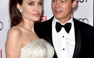 Angelina Jolie Pitt and husband Brad Pitt arrive at the AFI FEST 2015 presented by Audi opening night gala premiere of Universal Pictures' 'By The Sea' on November 5, 2015.