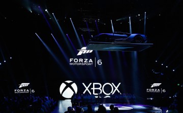 A Ford GT is lowered as 'Forza Motorsport 6' is displayed during the Microsoft Xbox E3 press conference at the Galen Center on June 15, 2015 in Los Angeles, California.