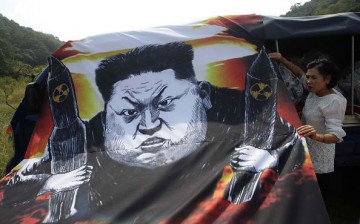 Defectors protest North Korea's nuclear arms program.