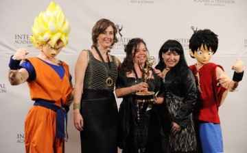 Samantha Artal Susskand and Paula Andrea Gomez Vera pose with actors dressed as cartoon characters Goku and Luffy at Nespresso Press Room at the 39th International Emmy Awards.
