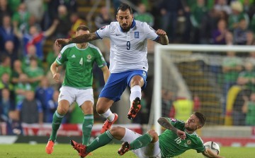 Greece striker Kostas Mitroglou (#9).