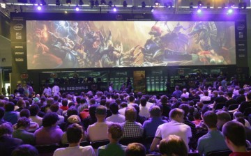 Gaming enthusiasts watch a League of Legends game 3 at the Gamescom 2012 gaming trade fair on August 16, 2012 in Cologne, Germany.