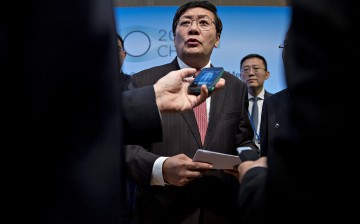 Lou Jiwei, China's finance minister, speaks to G-20 finance ministers and central bank governors during a news conference at the IMF and World Bank Group Annual Meetings on Oct. 7.
